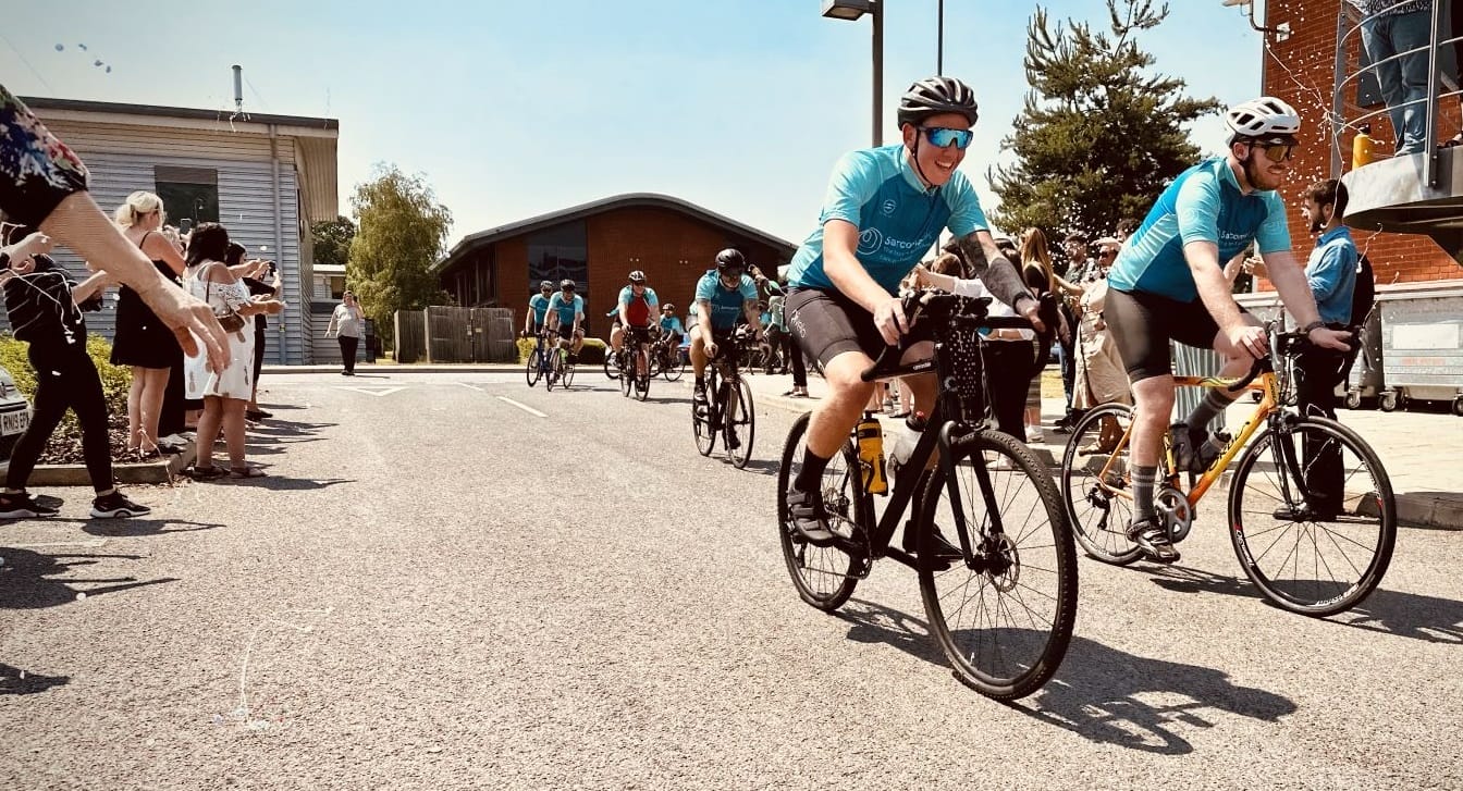 Anesco charity cyclists arrive at head office